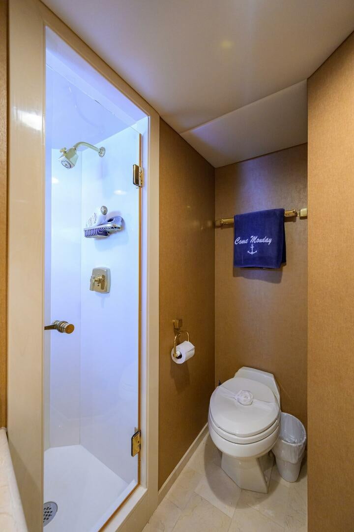 a bathroom with a toilet and a shower aboard BUSINESS TRIP 2 Yacht for Sale