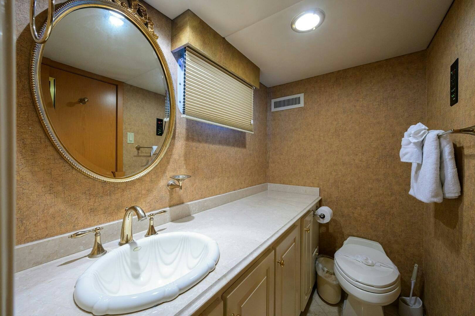 a bathroom with a large mirror aboard BUSINESS TRIP 2 Yacht for Sale