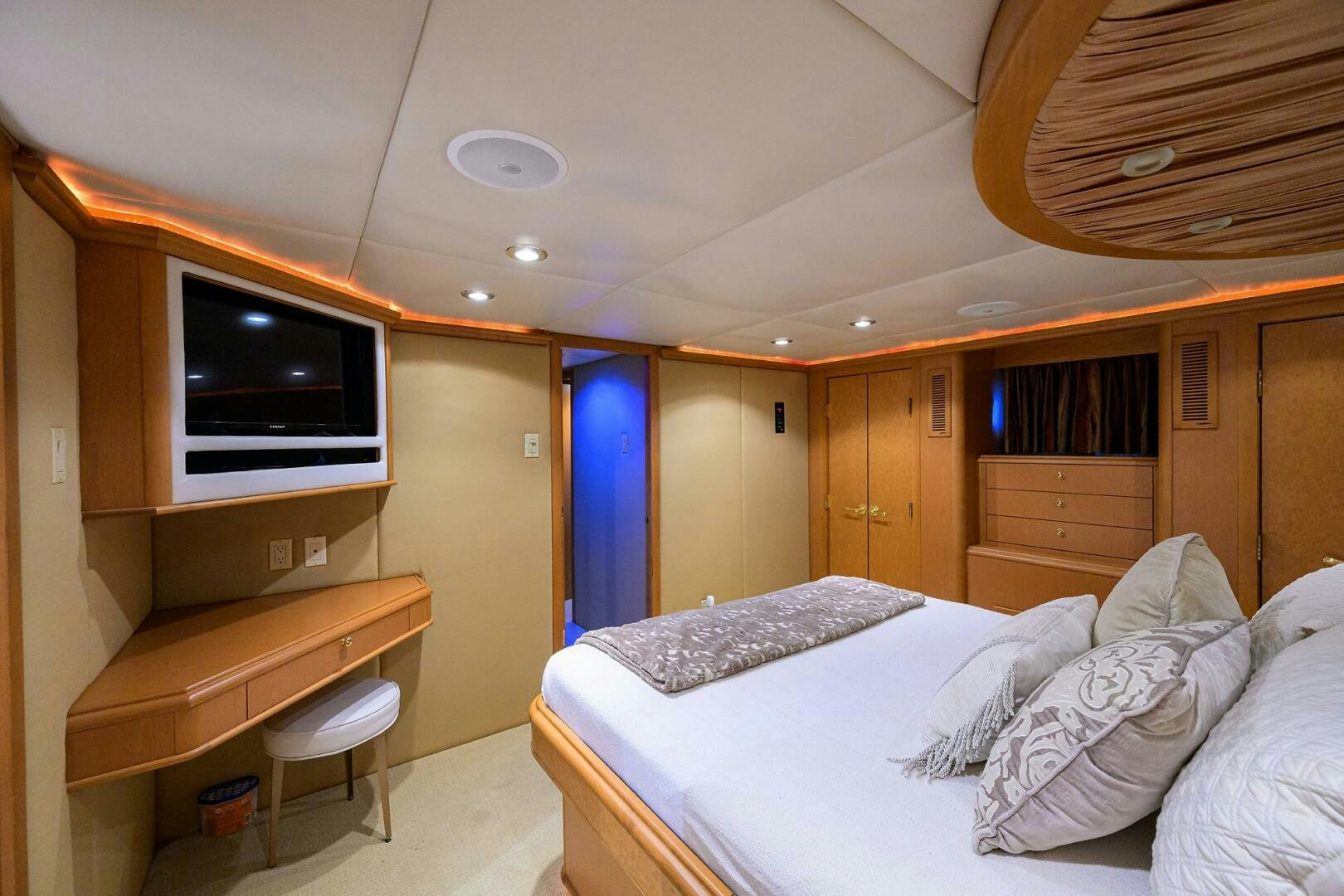 a bedroom with a bed and a television aboard BUSINESS TRIP 2 Yacht for Sale