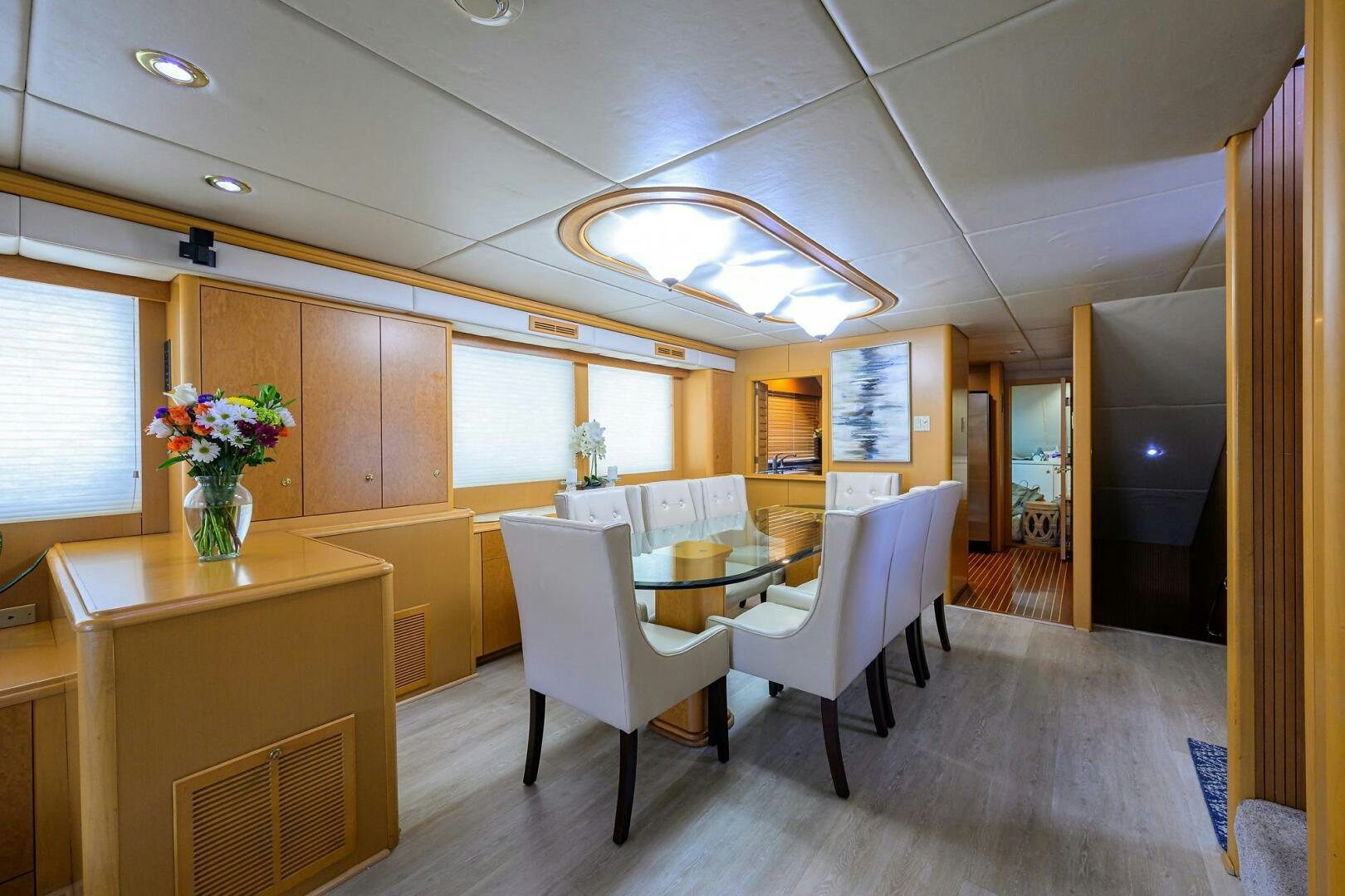 a room with tables and chairs aboard BUSINESS TRIP 2 Yacht for Sale