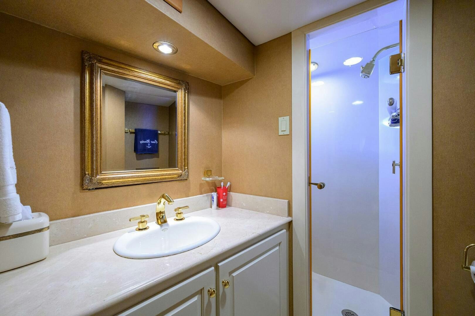 a bathroom with a large mirror aboard BUSINESS TRIP 2 Yacht for Sale