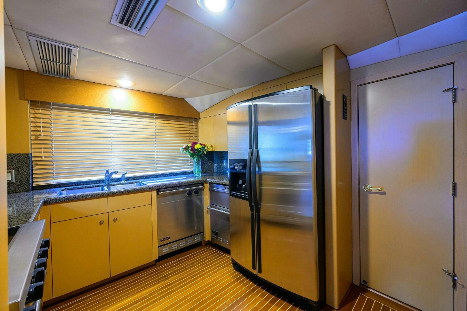 a kitchen with a large refrigerator aboard BUSINESS TRIP 2 Yacht for Sale
