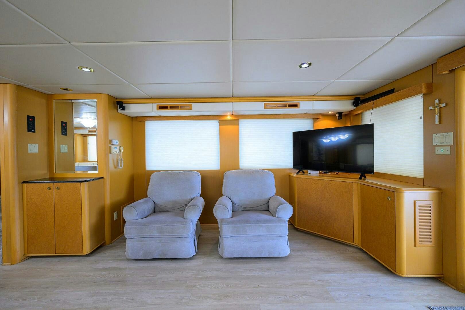 a room with a tv and a chair aboard BUSINESS TRIP 2 Yacht for Sale