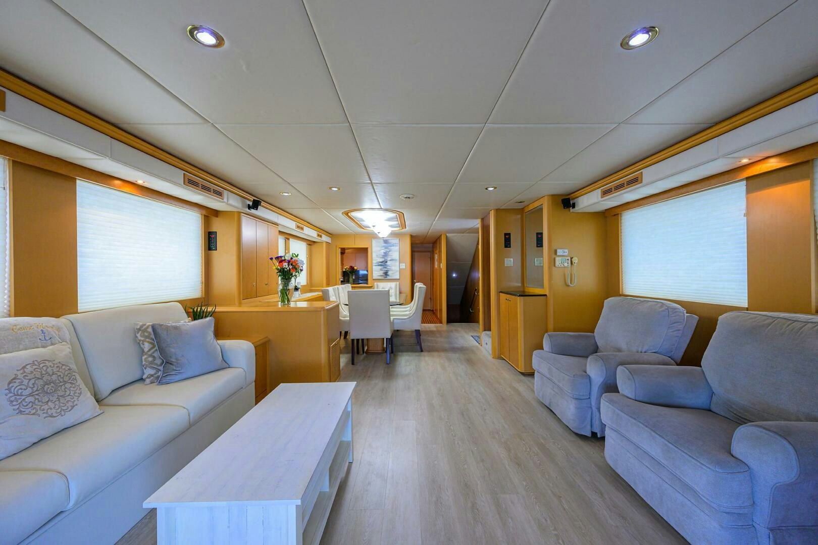 a living room with a couch and a table aboard BUSINESS TRIP 2 Yacht for Sale