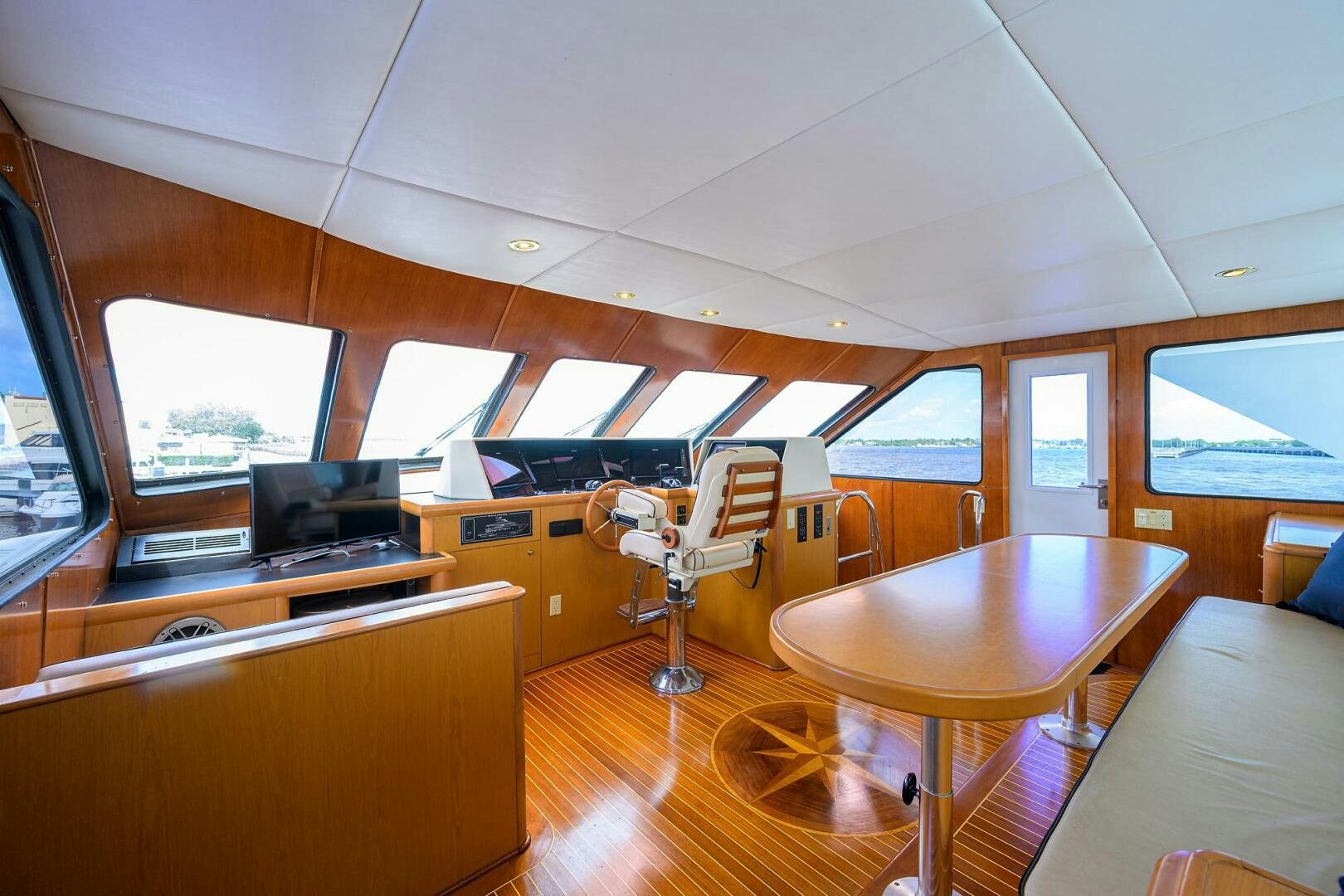 a room with a table and chairs aboard BUSINESS TRIP 2 Yacht for Sale