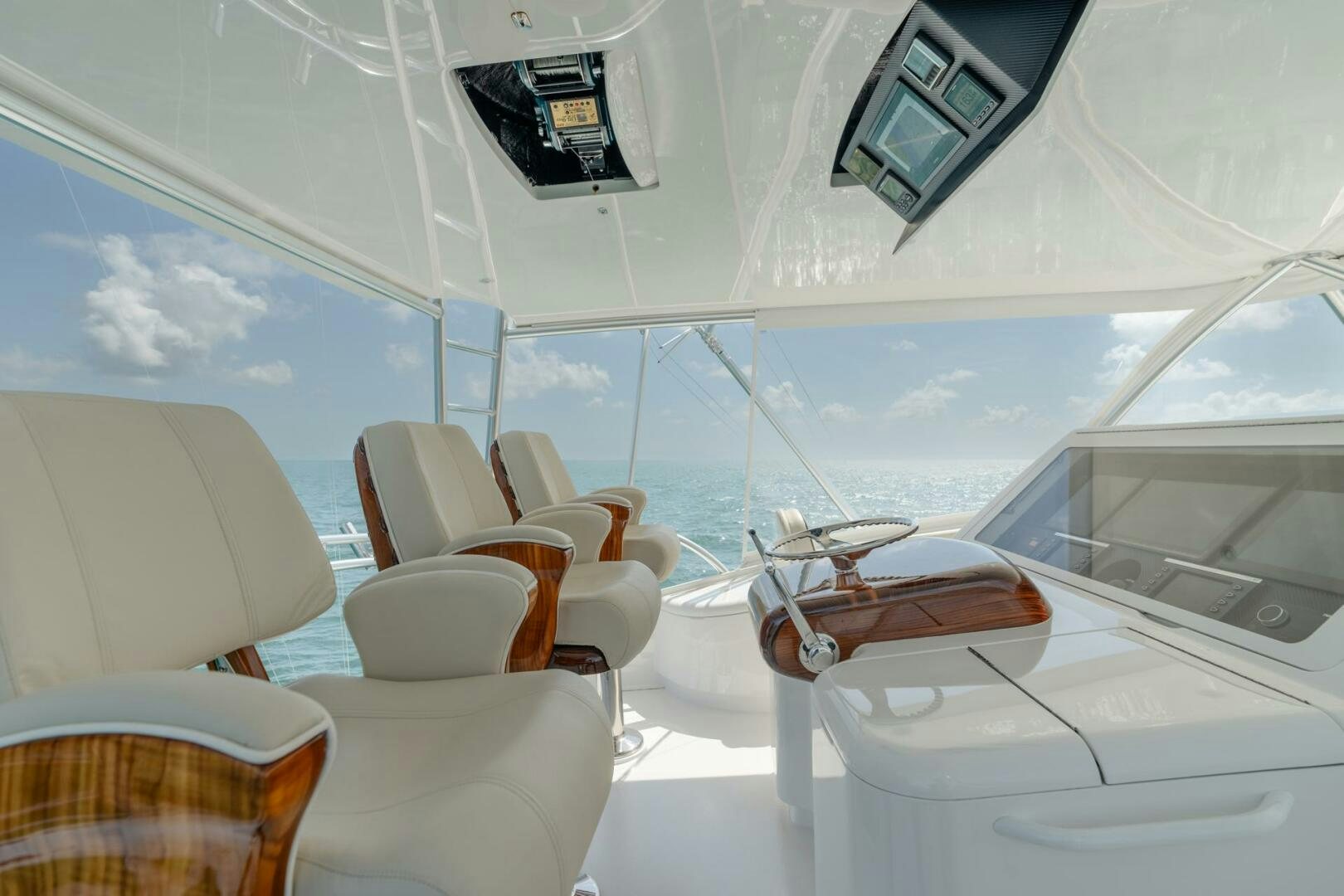 a room with chairs and a table aboard REEL CENTS Yacht for Sale