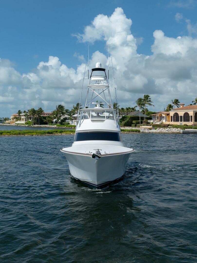 a white boat on water aboard REEL CENTS Yacht for Sale