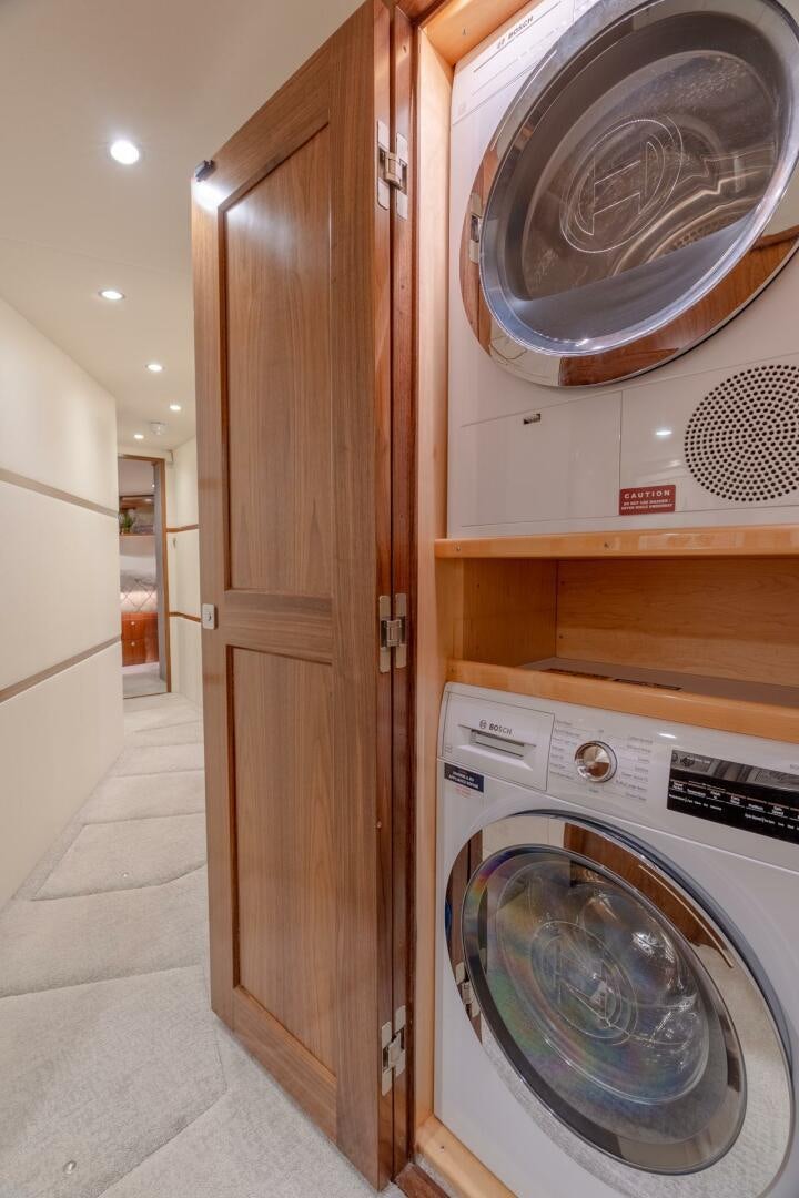 a laundry room with a dryer aboard REEL CENTS Yacht for Sale