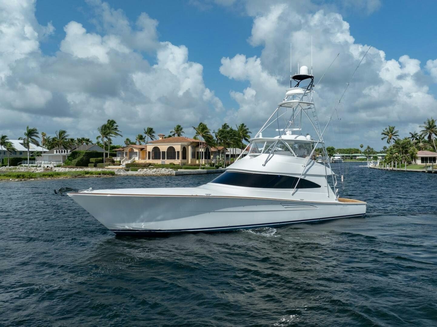 a white boat on the water aboard REEL CENTS Yacht for Sale