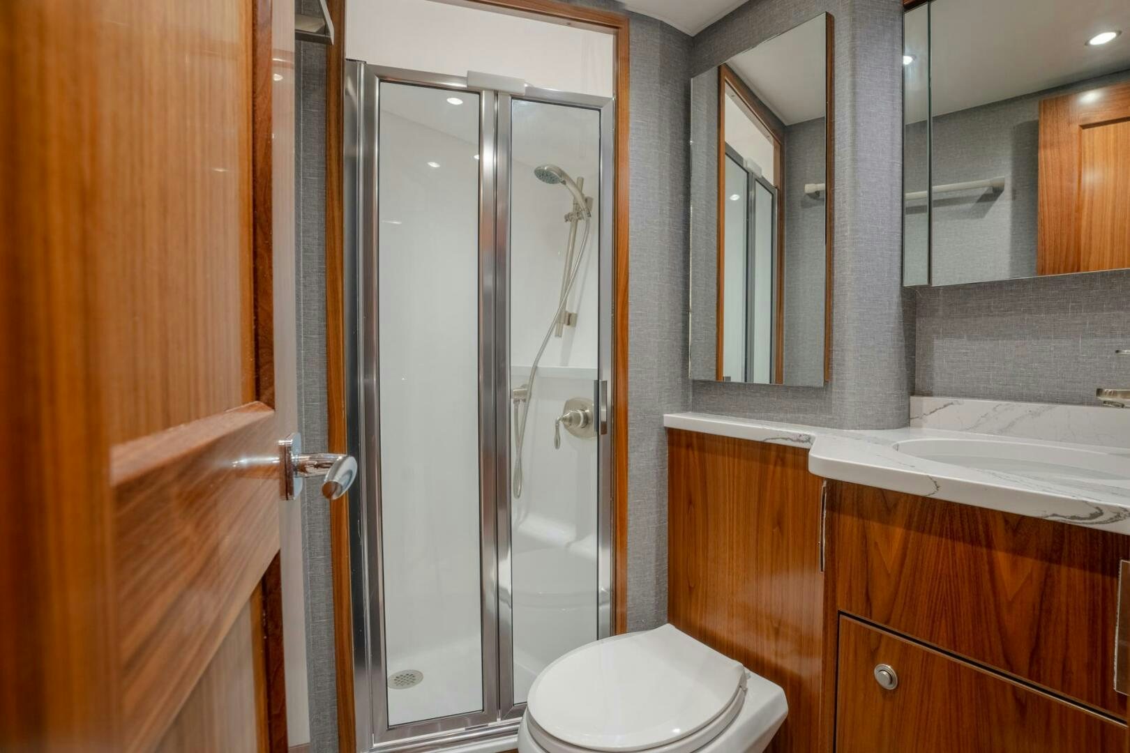 a bathroom with a glass shower aboard REEL CENTS Yacht for Sale