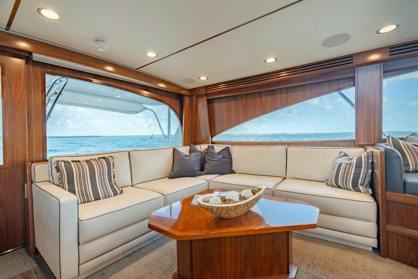 a living room with a couch and a table aboard REEL CENTS Yacht for Sale