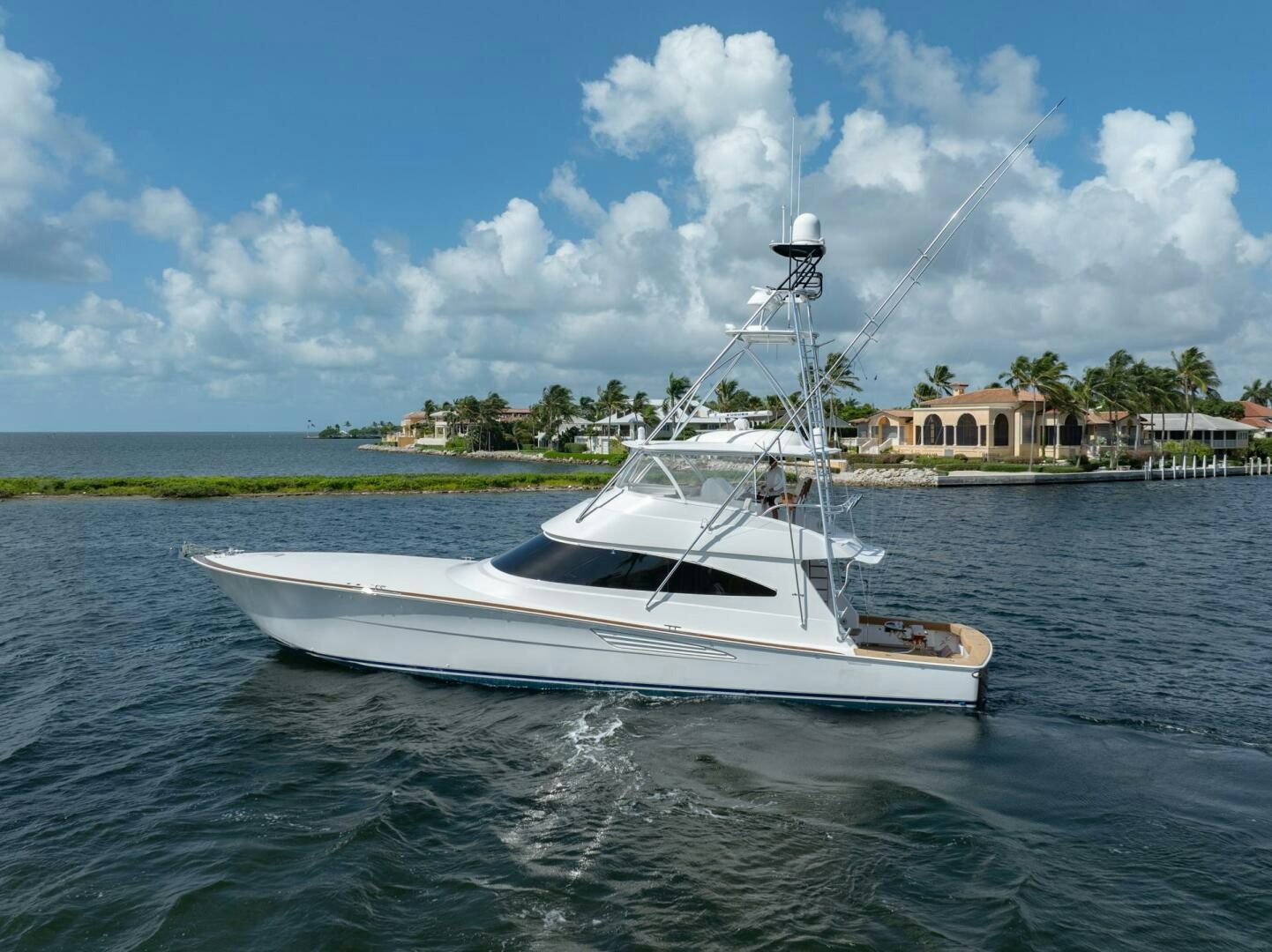 a white boat in the water aboard REEL CENTS Yacht for Sale