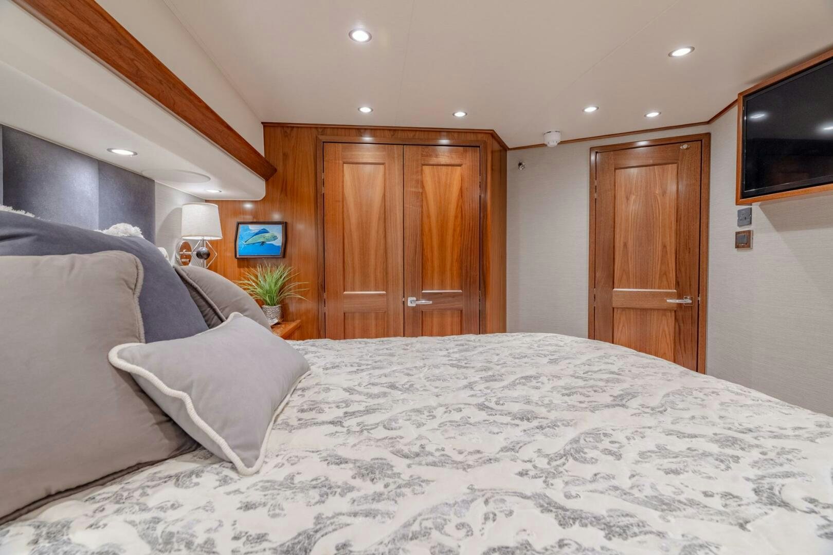 a bed with white sheets aboard REEL CENTS Yacht for Sale