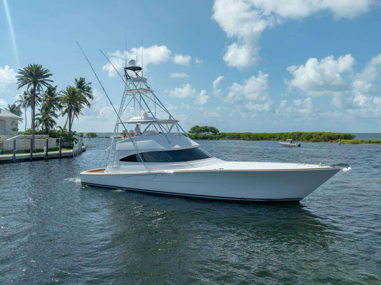 a white boat on the water aboard REEL CENTS Yacht for Sale