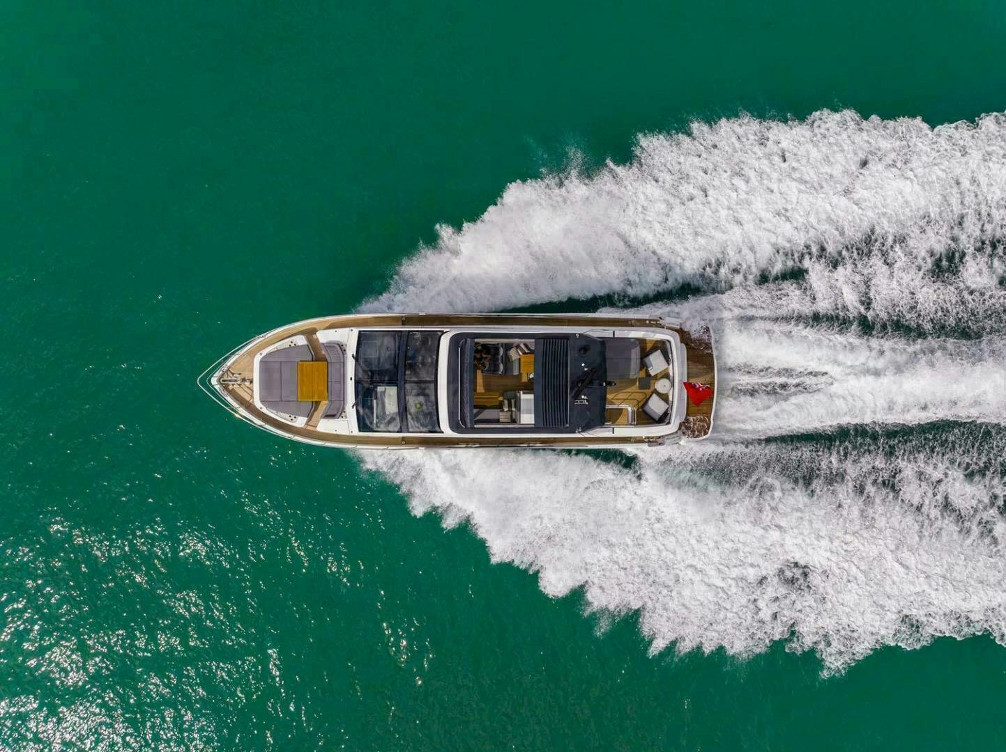 a helicopter flying over a sea aboard NONE Yacht for Sale