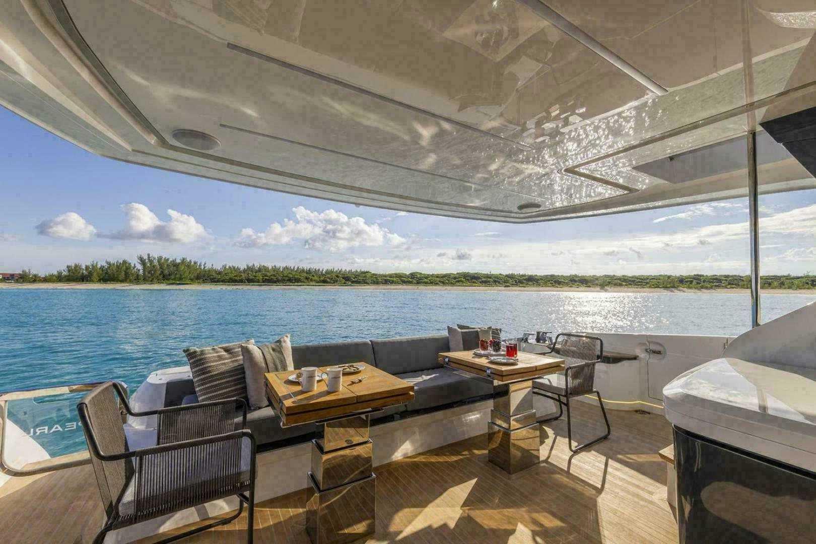 a room with a table and chairs aboard NONE Yacht for Sale