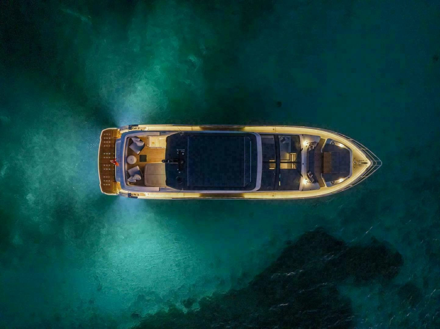 a gold and silver object floating in the water aboard NONE Yacht for Sale