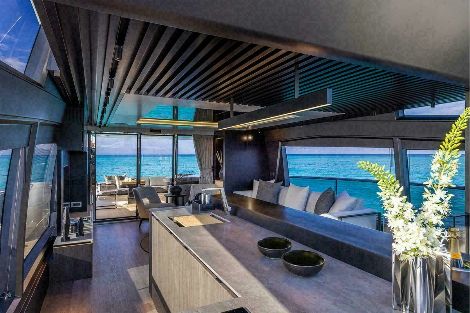 a modern looking living room with a large open floor plan aboard NONE Yacht for Sale