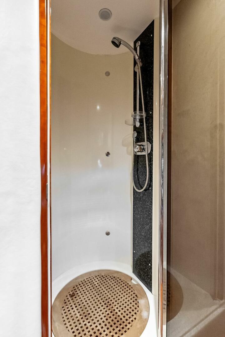 a shower with a shower head aboard GAMBLER Yacht for Sale