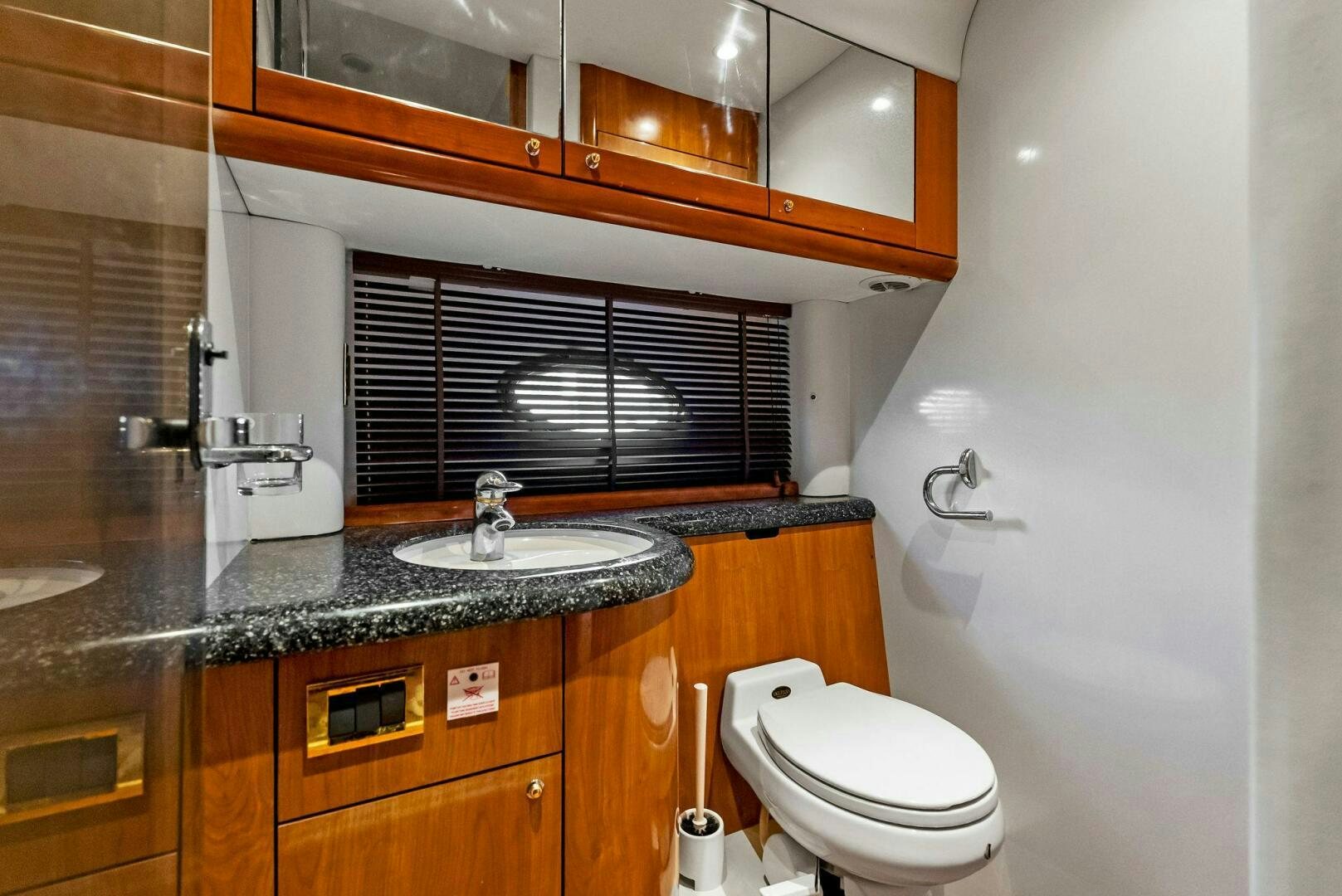 a bathroom with a sink and a toilet aboard GAMBLER Yacht for Sale