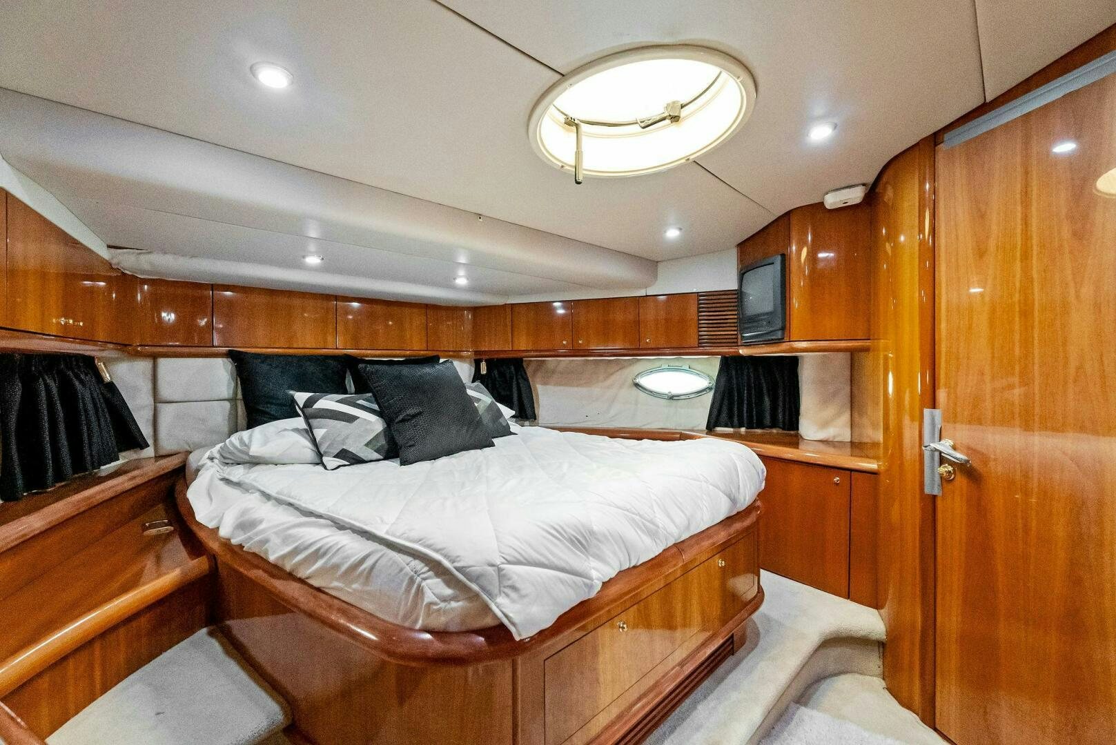 a room with two beds aboard GAMBLER Yacht for Sale