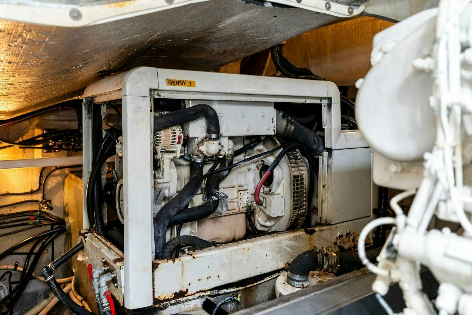 a machine with a large piece of equipment in it aboard GAMBLER Yacht for Sale