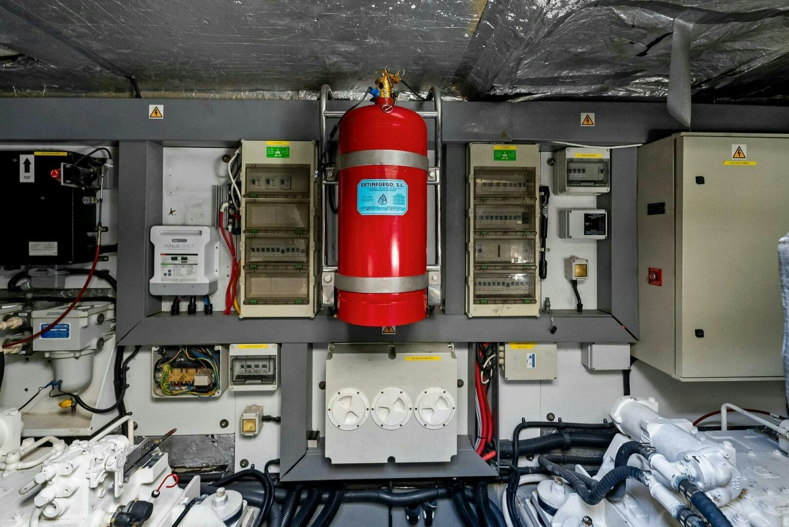 a red and white machine aboard GAMBLER Yacht for Sale