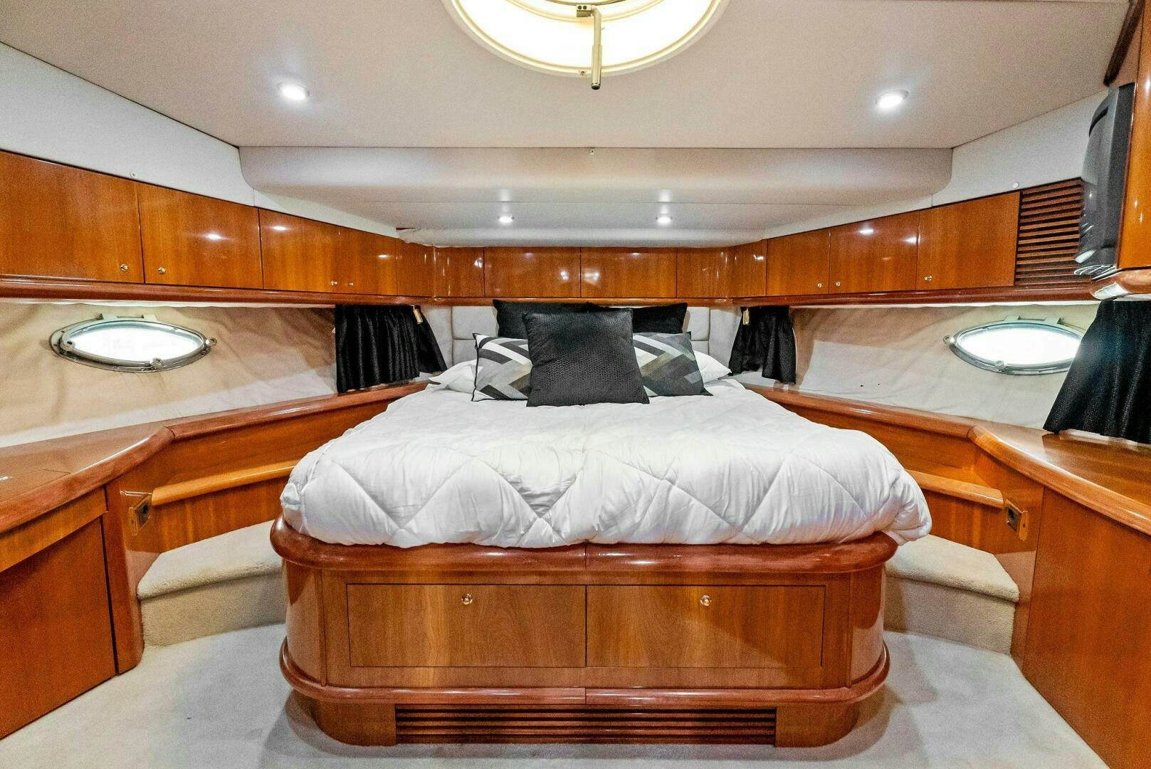 a room with a couple of beds aboard GAMBLER Yacht for Sale