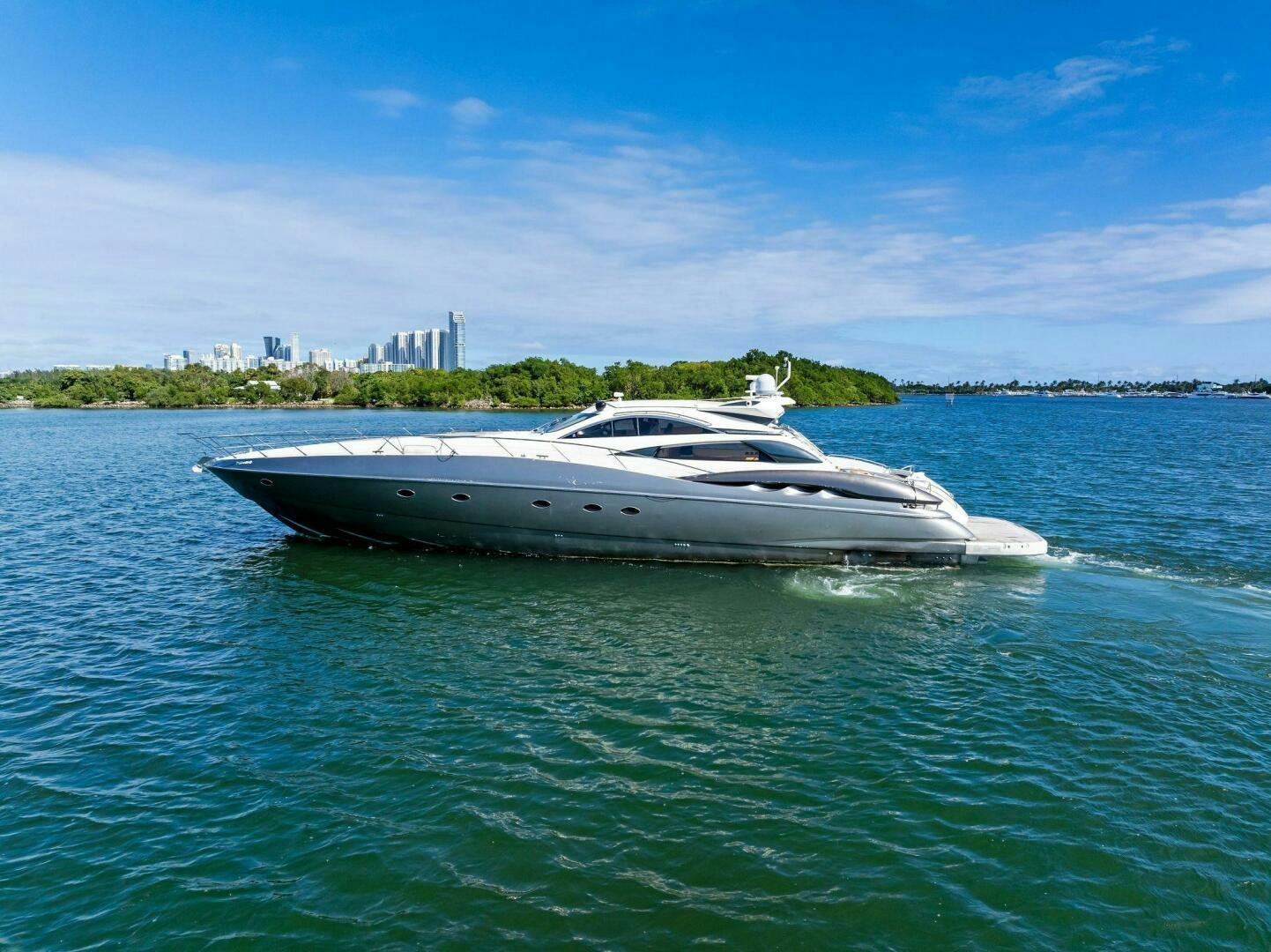 a white yacht in the water aboard GAMBLER Yacht for Sale