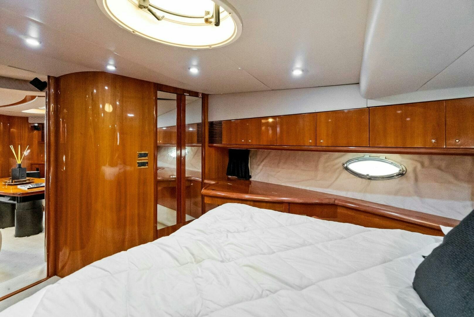 a room with a bed and a desk aboard GAMBLER Yacht for Sale