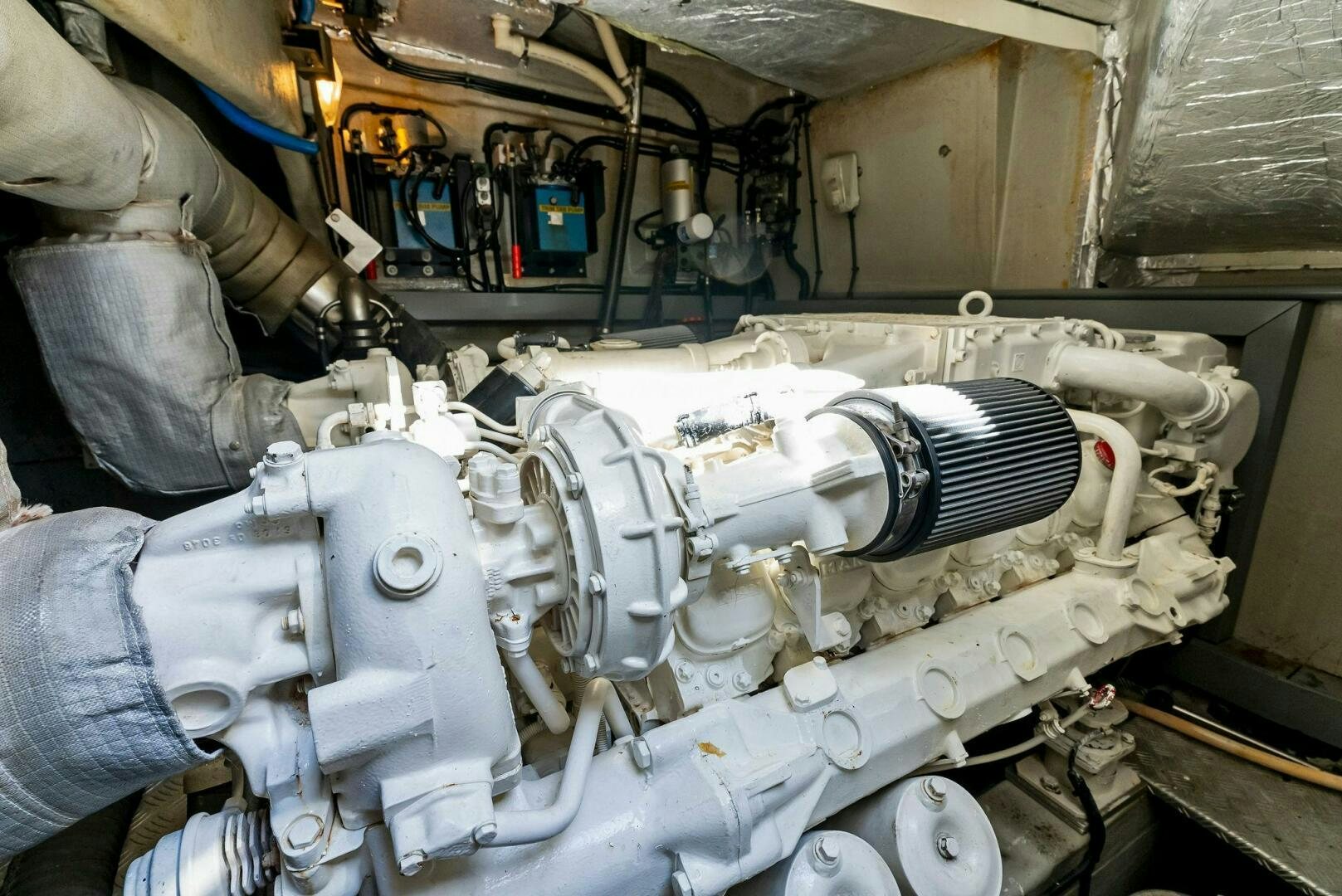 a machine with a large metal cylinder aboard GAMBLER Yacht for Sale