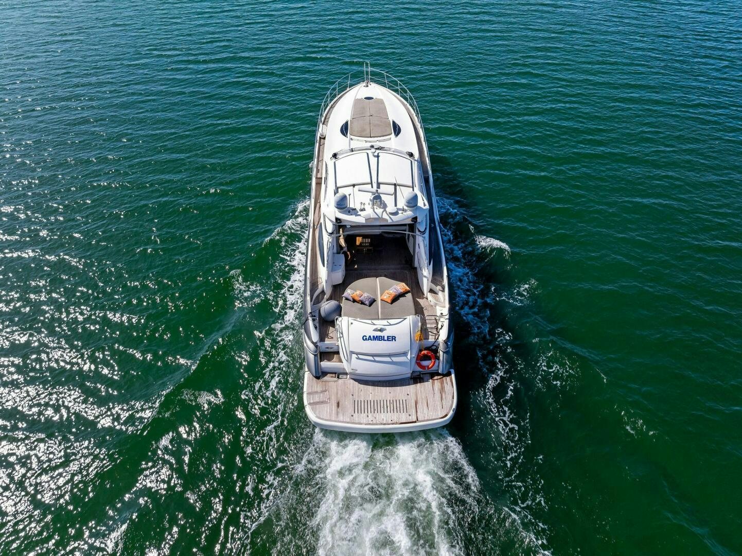 a boat sailing on the sea aboard GAMBLER Yacht for Sale