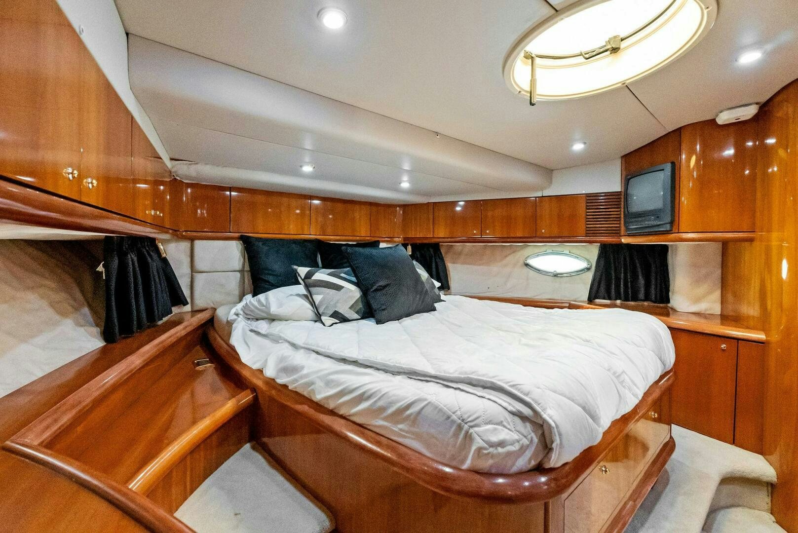 a room with bunk beds aboard GAMBLER Yacht for Sale
