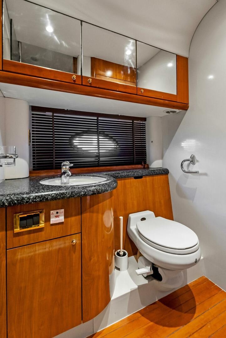 a bathroom with a sink and a toilet aboard GAMBLER Yacht for Sale