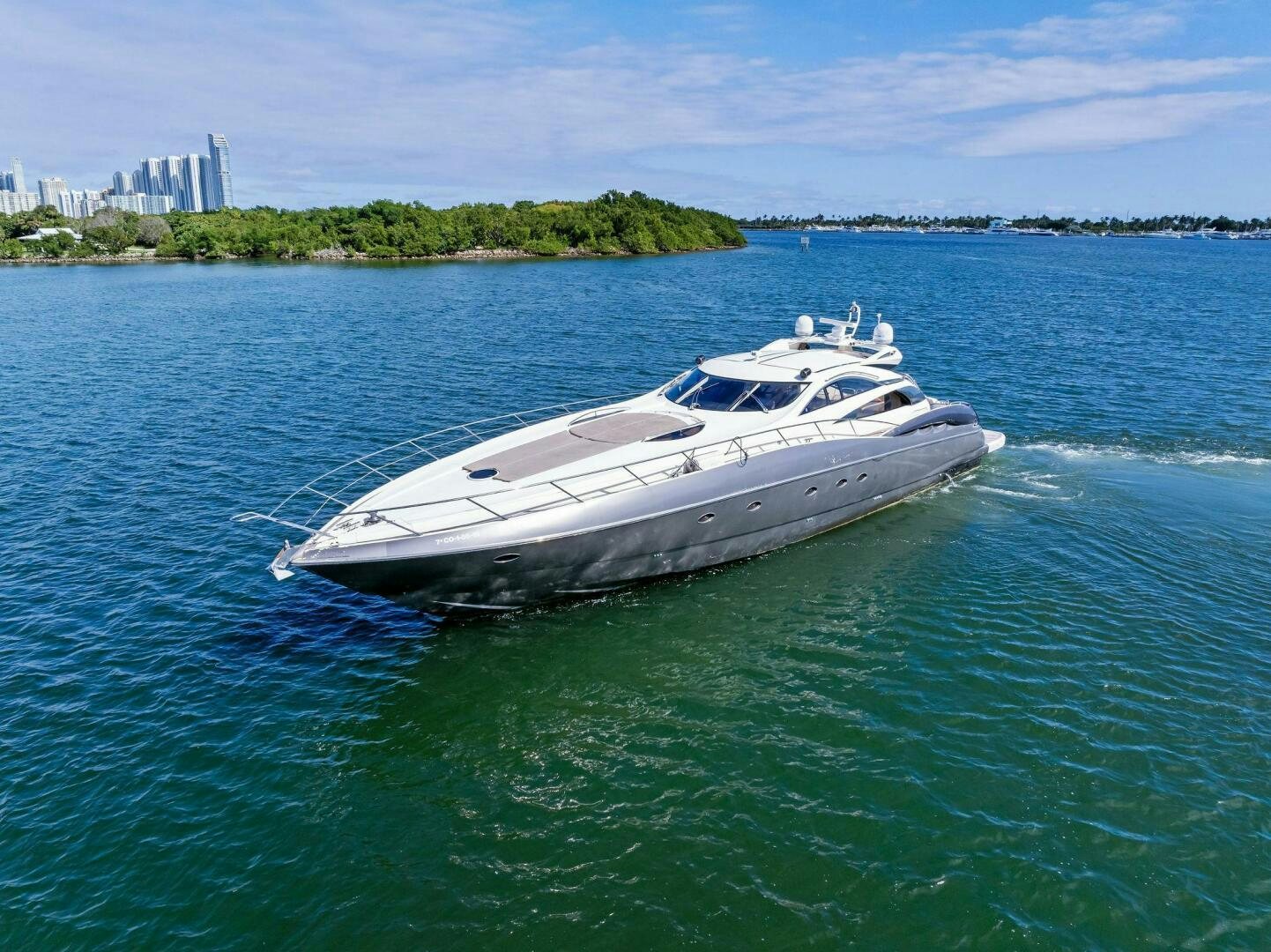 a white yacht in the water aboard GAMBLER Yacht for Sale