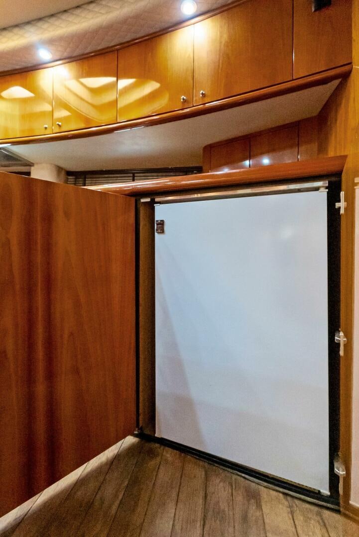 a refrigerator in a kitchen aboard GAMBLER Yacht for Sale