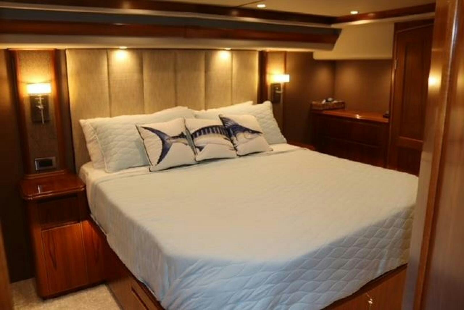 a bed with white sheets aboard BANDITO Yacht for Sale
