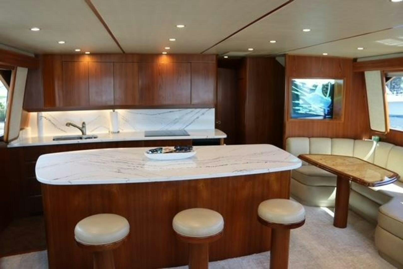 a kitchen with wooden cabinets aboard BANDITO Yacht for Sale