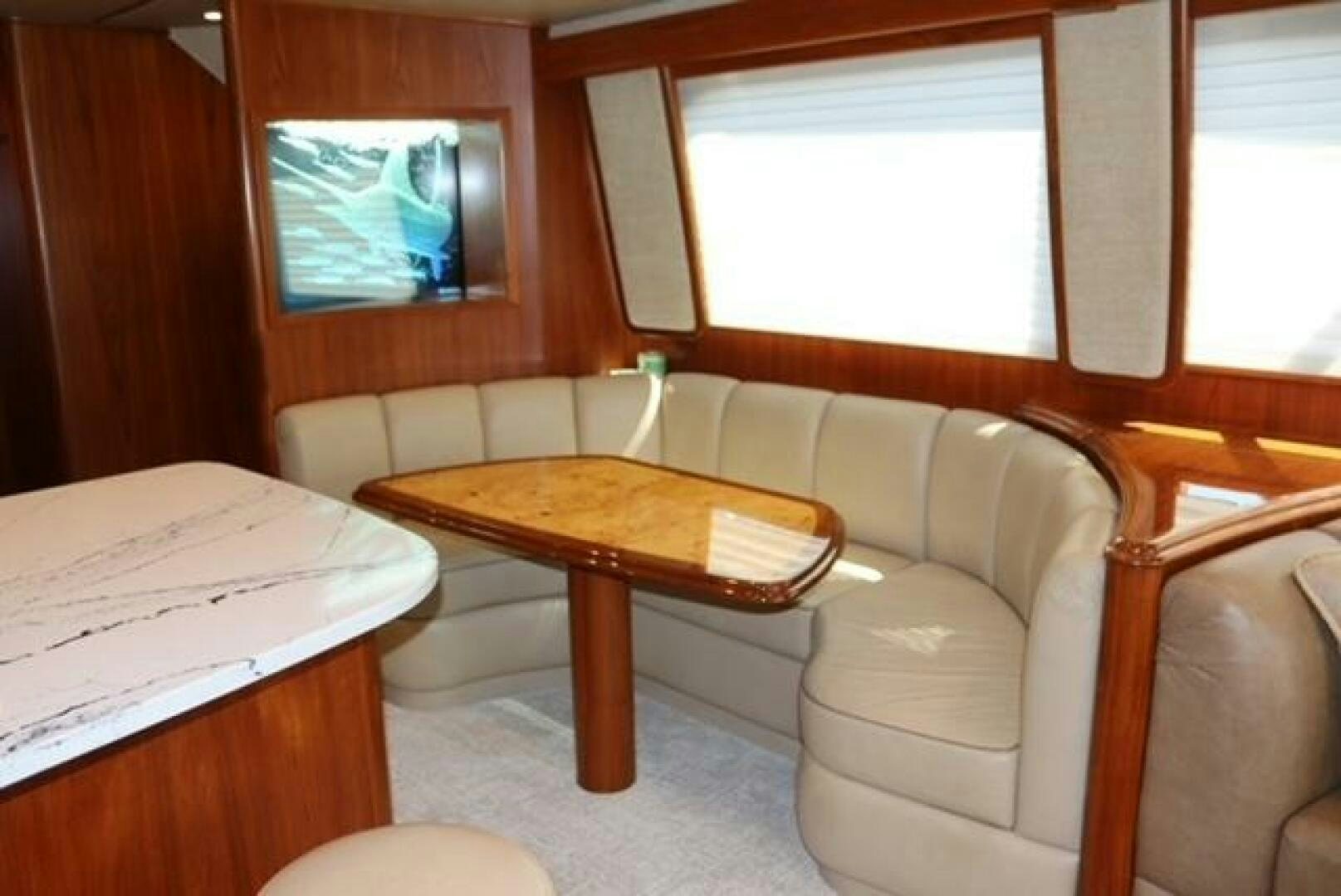 a living room with a couch and a television aboard BANDITO Yacht for Sale