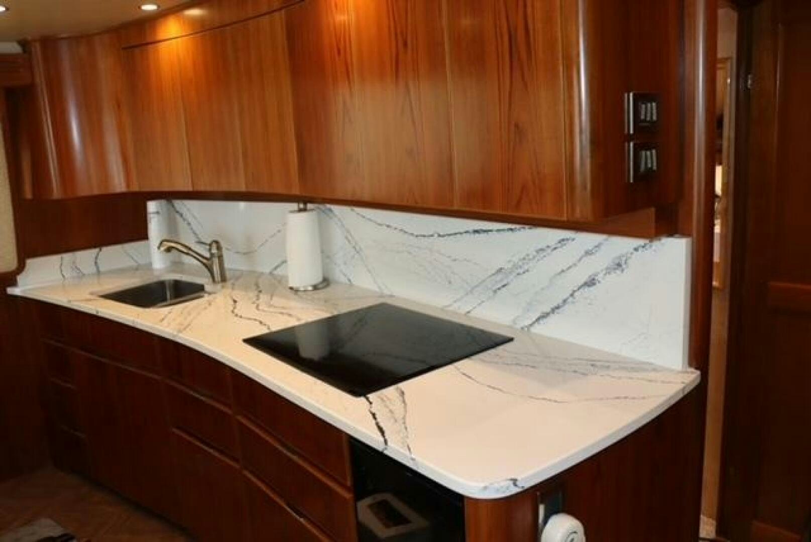 a kitchen with a sink and cabinets aboard BANDITO Yacht for Sale