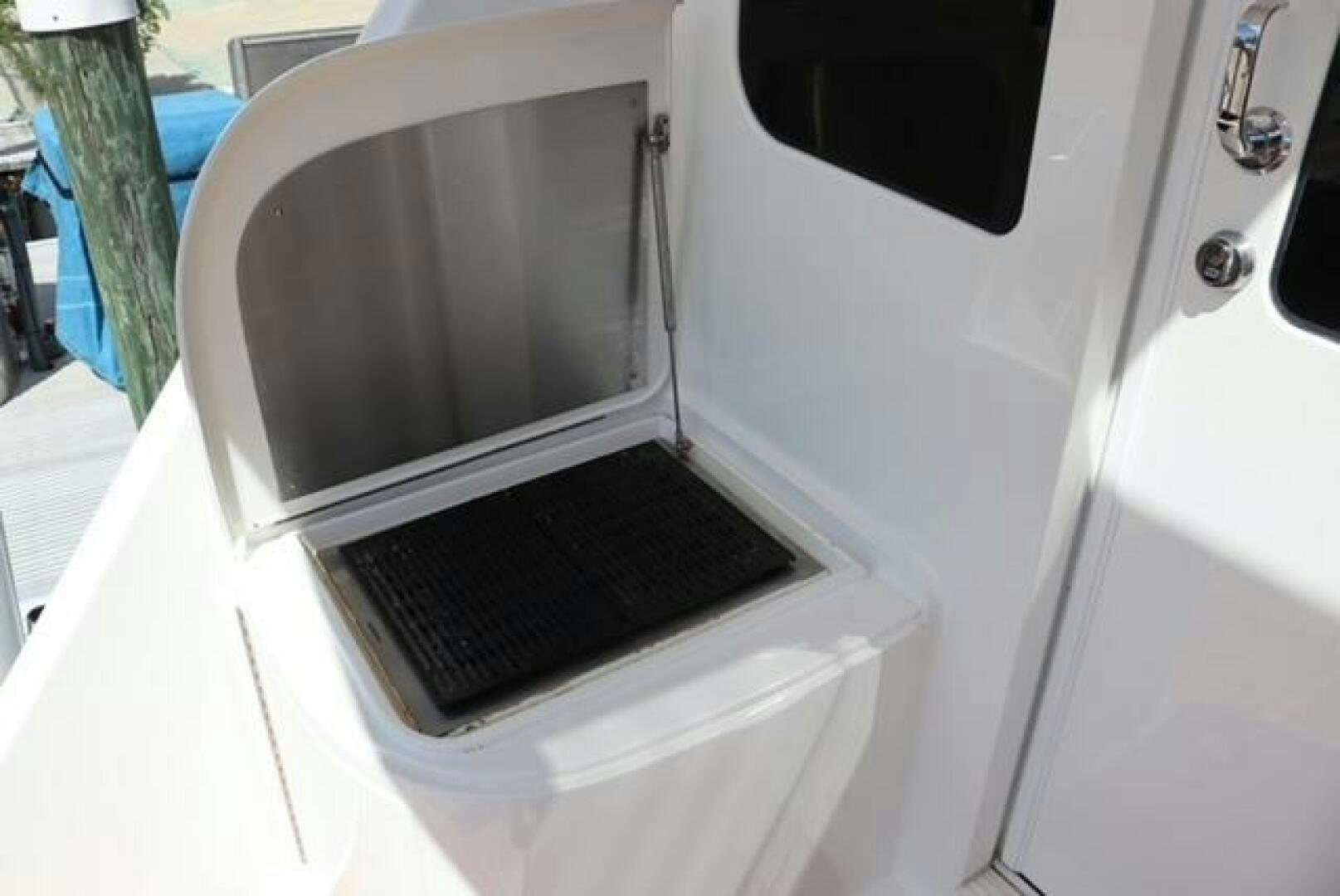 a white car with a black seat aboard BANDITO Yacht for Sale