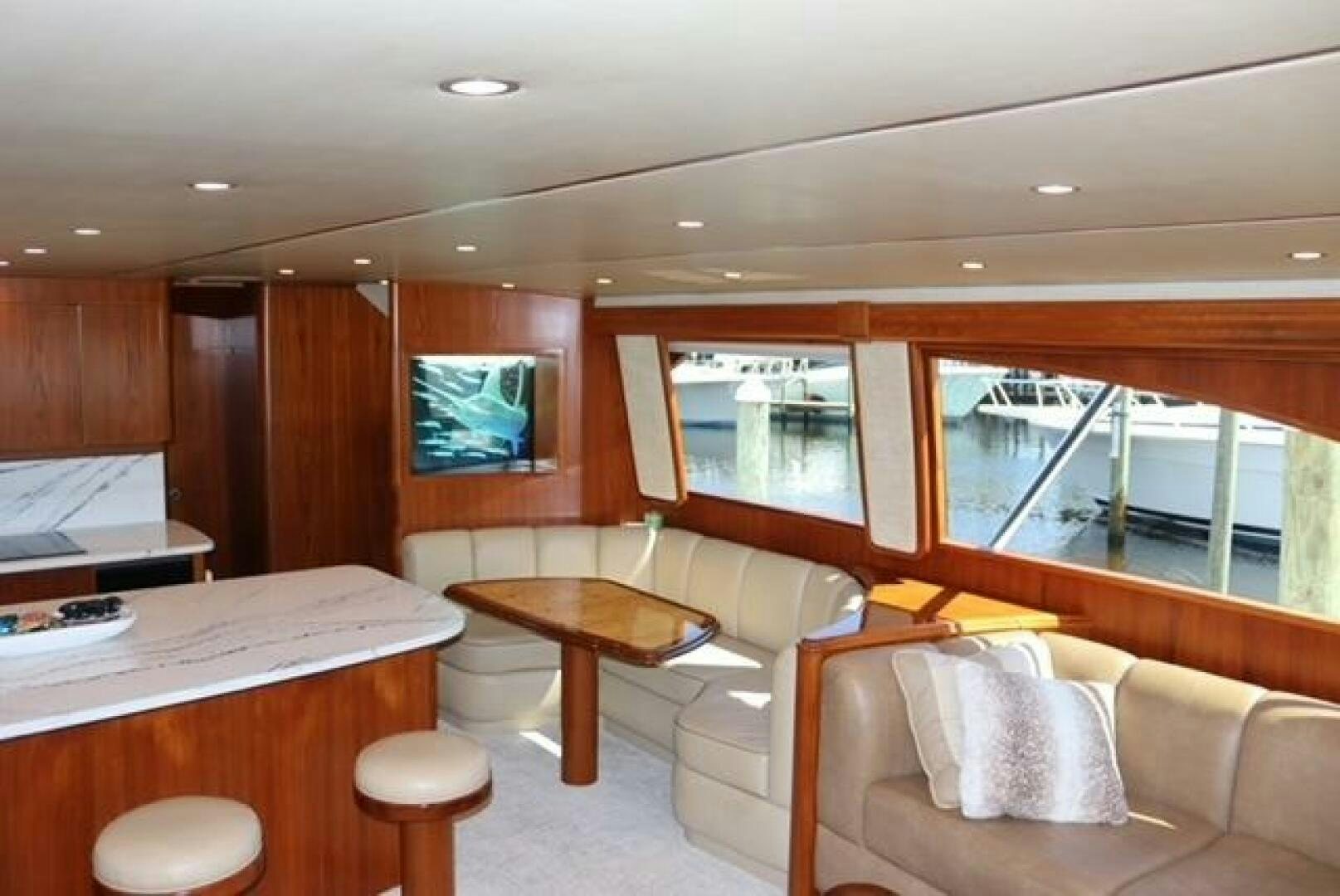 a room with a couch and a table and a television aboard BANDITO Yacht for Sale