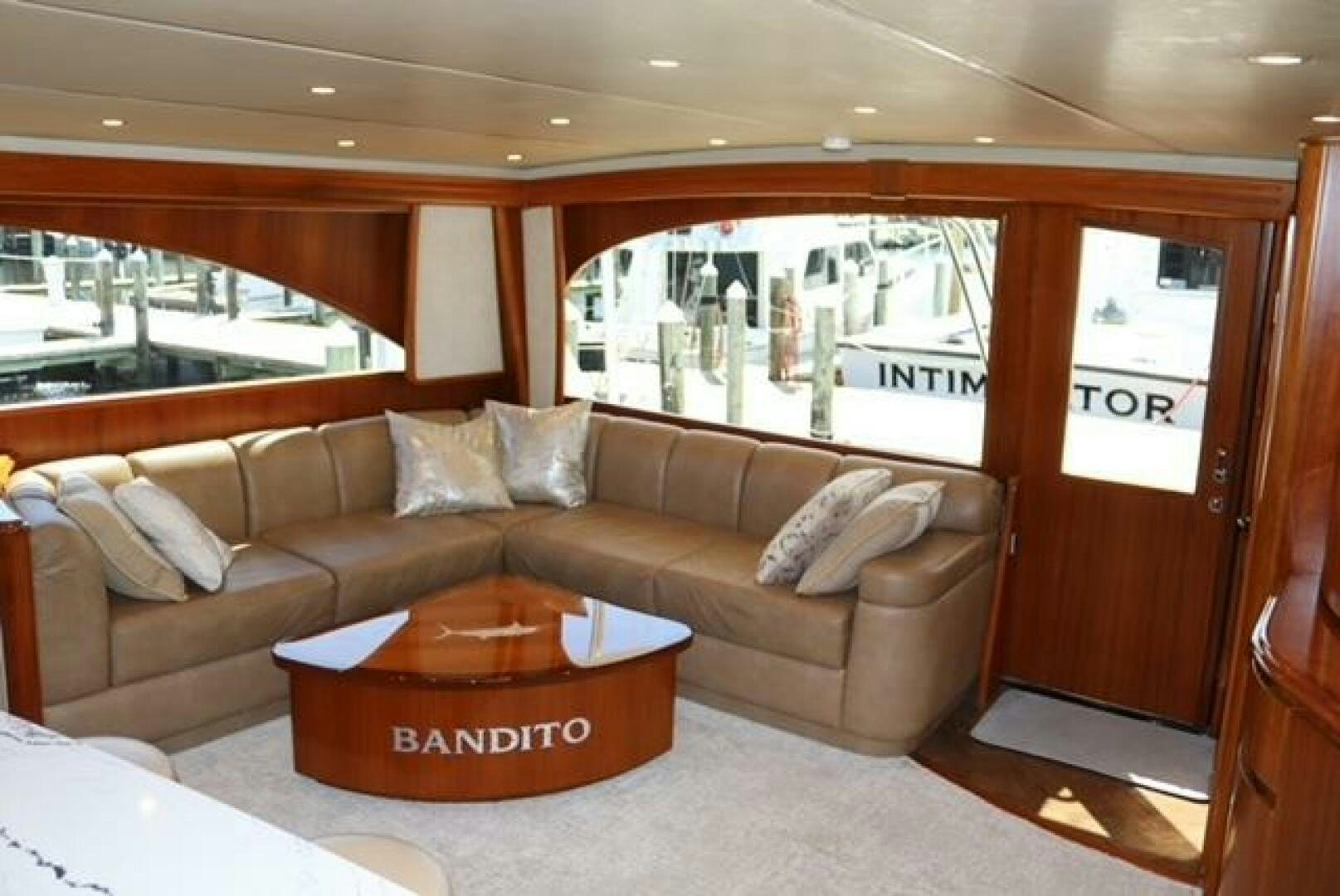a couch with a coffee table aboard BANDITO Yacht for Sale
