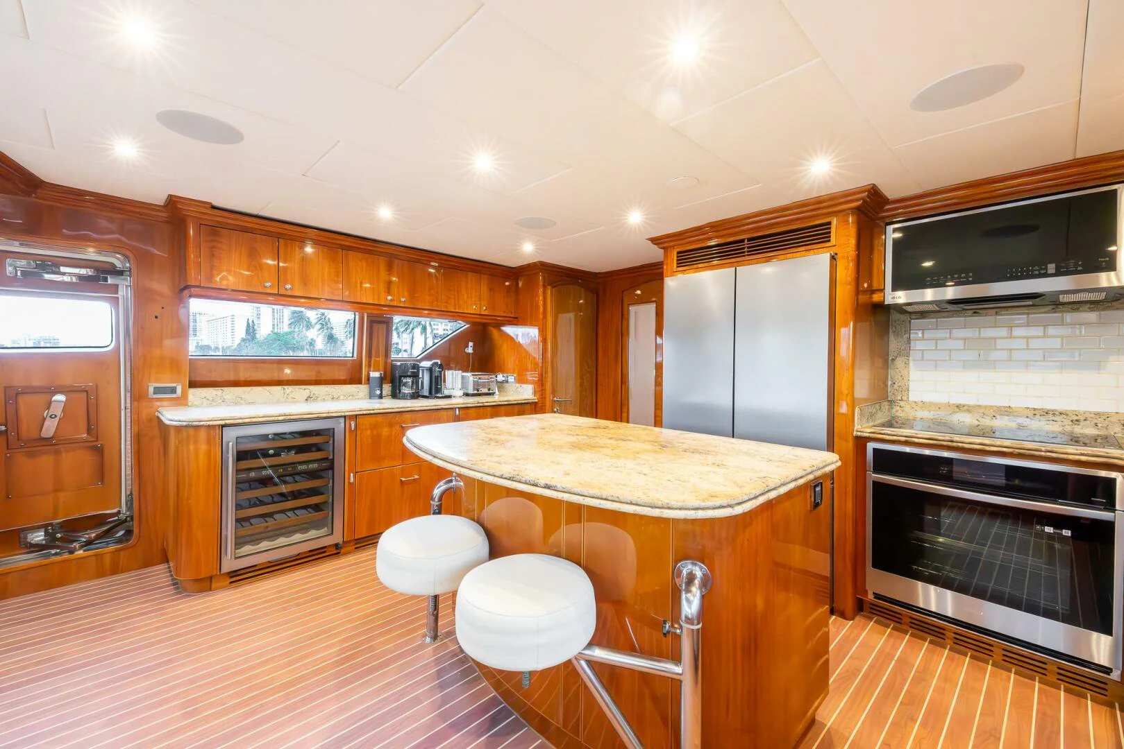 a kitchen with wooden cabinets aboard OCEAN 1 Yacht for Sale