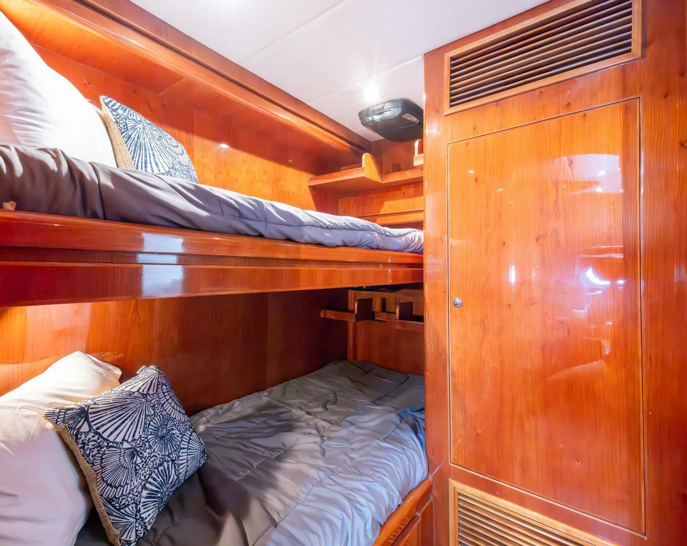 a bed with a wood headboard aboard OCEAN 1 Yacht for Sale