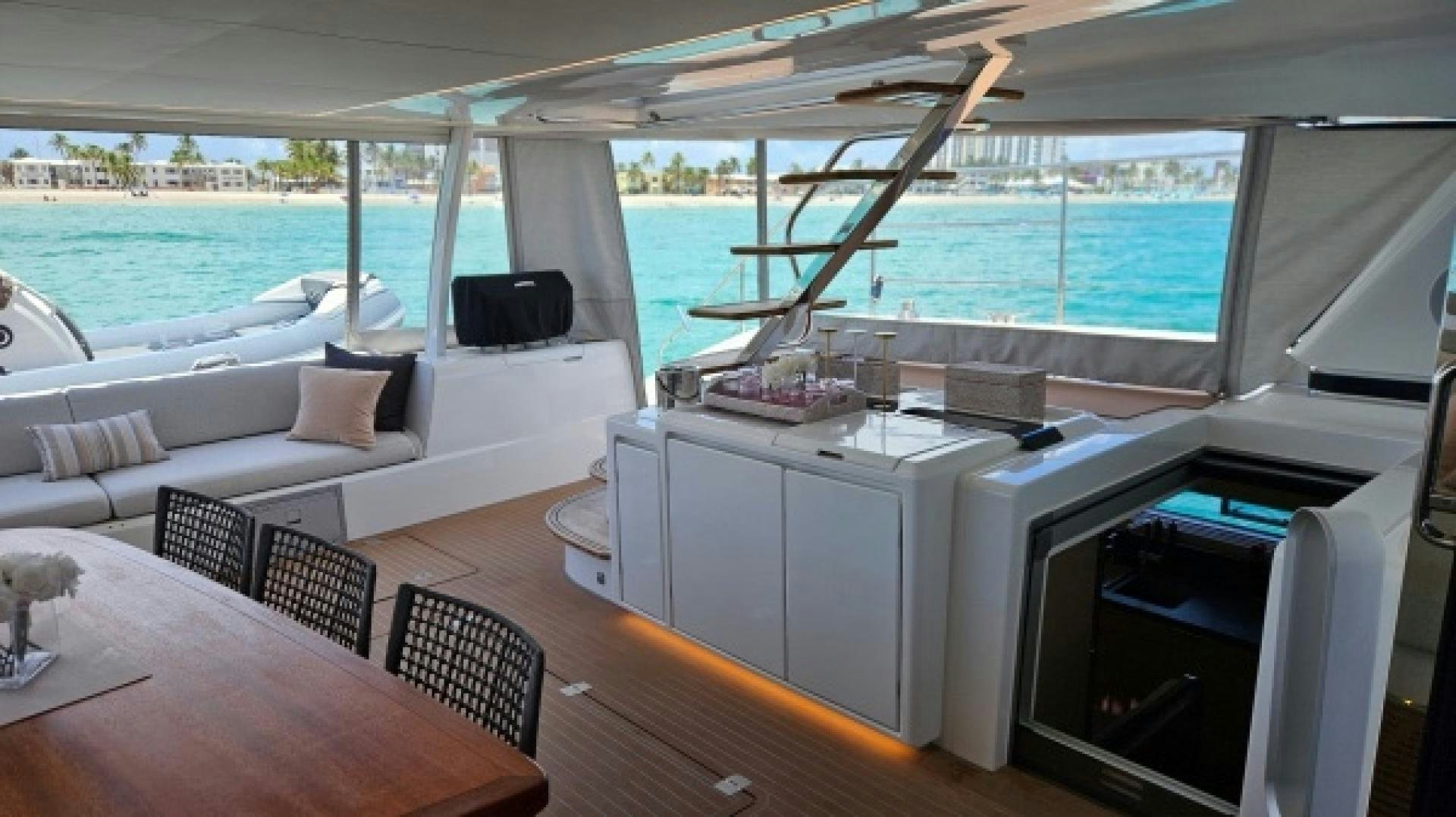 a room with a table and chairs aboard SUNLOVE Yacht for Sale