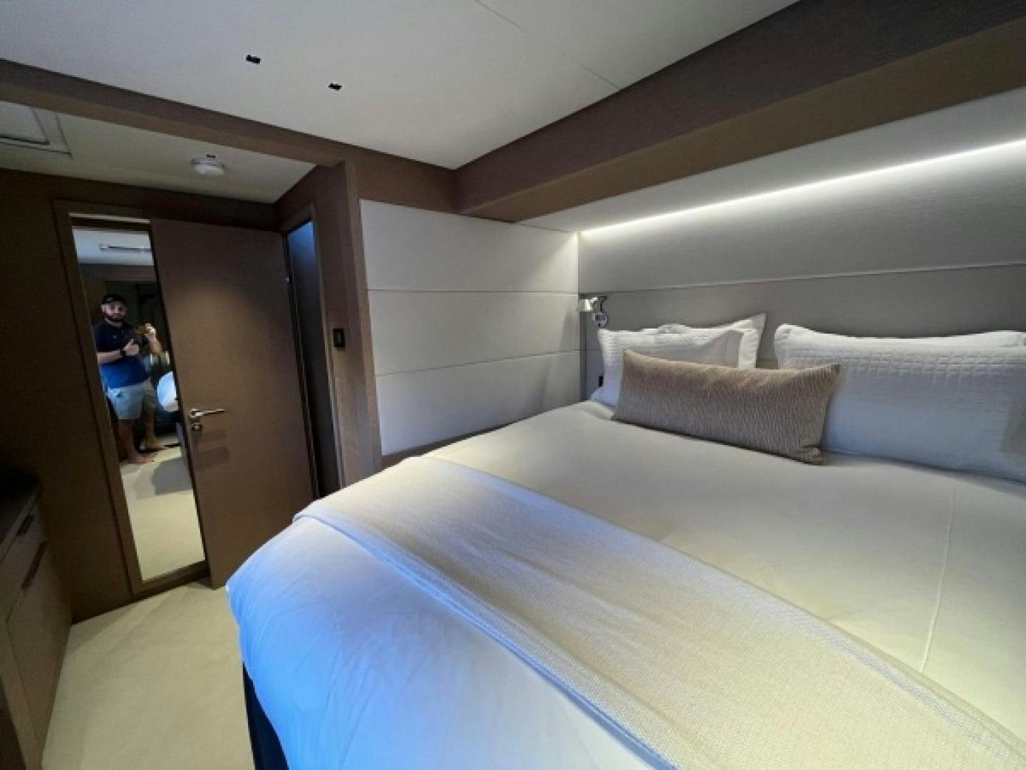 a bed with white sheets aboard SUNLOVE Yacht for Sale