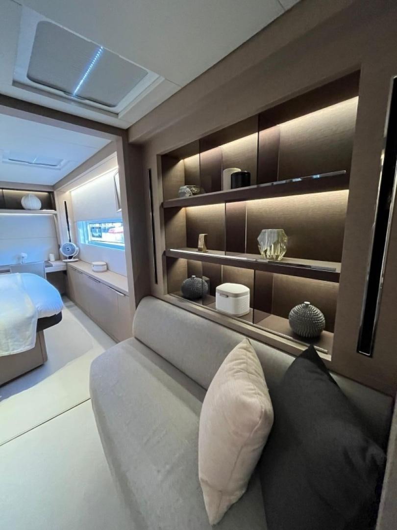 a room with a couch and shelves aboard SUNLOVE Yacht for Sale