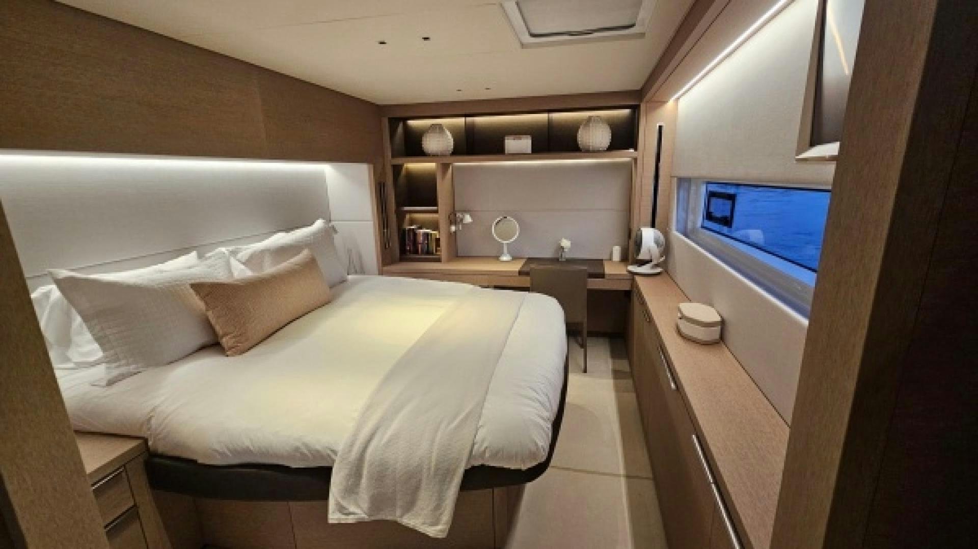 a room with a bed and a tv aboard SUNLOVE Yacht for Sale