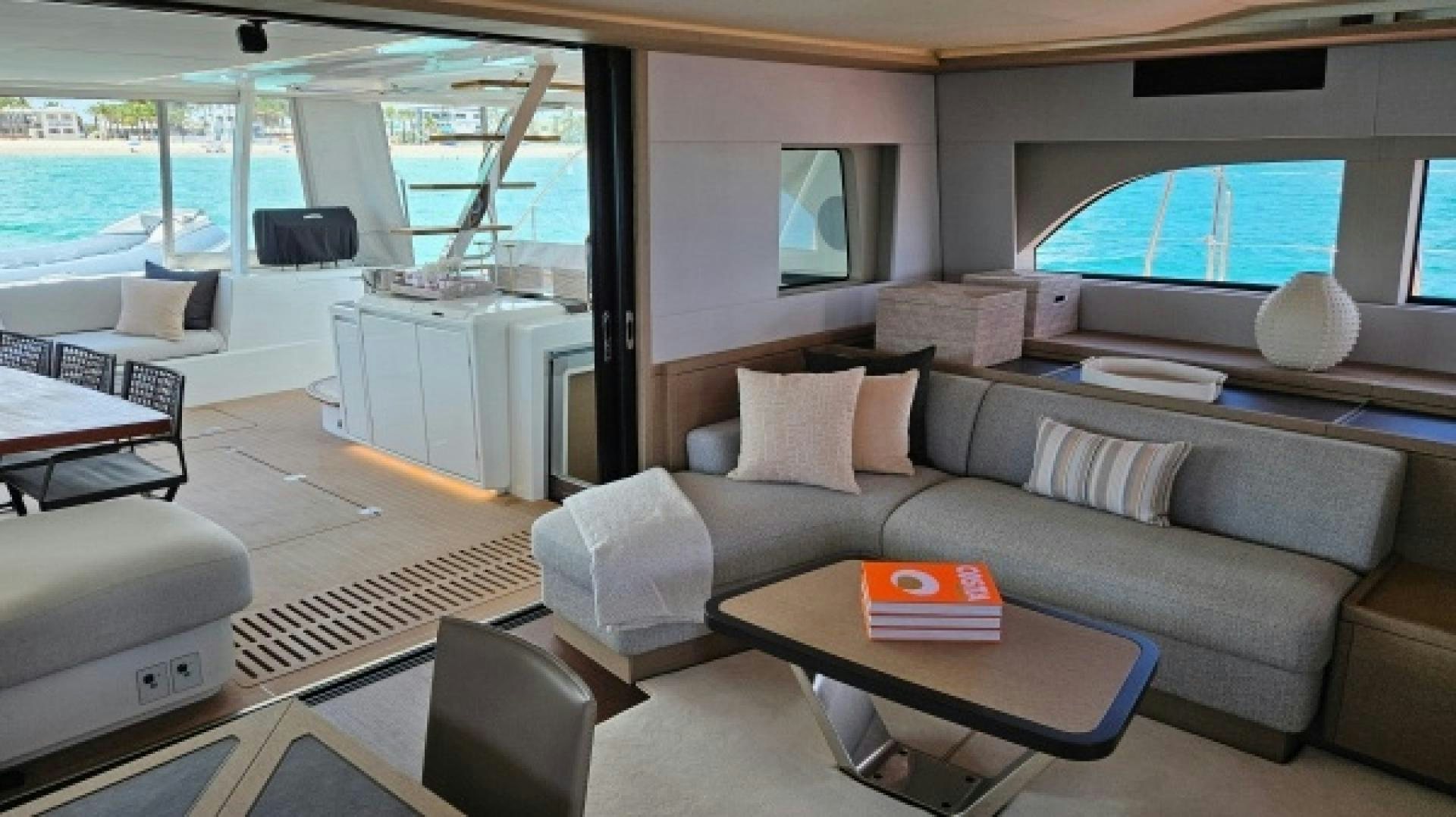 a living room with a couch and a table aboard SUNLOVE Yacht for Sale